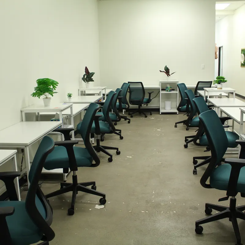 Rows of desks with green office chairs and monitors in the Beanchain workspace.