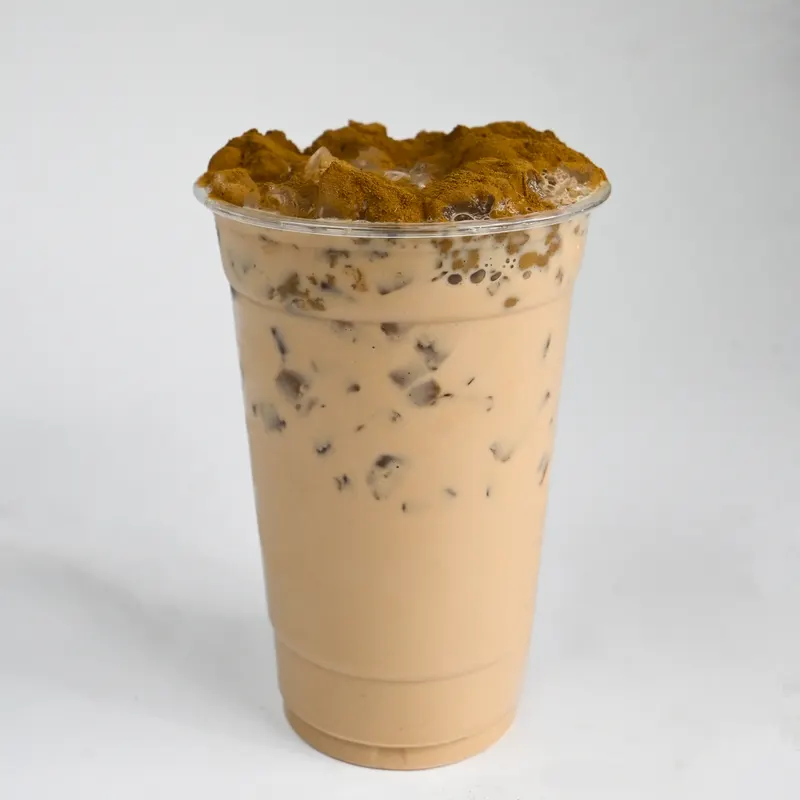 A French Toast Latte over ice in a clear cup.