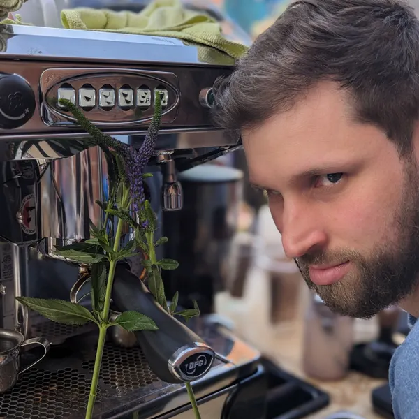 A barista pulling shots on the espresso machine.