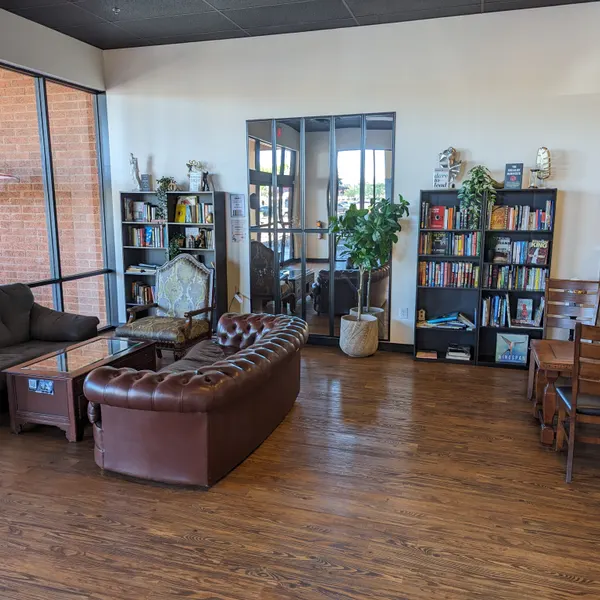 The lounge and community library, with sofas and donated books.