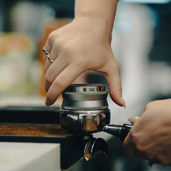 Tamping a shot of espresso.